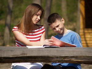 Children helping each other image